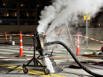 Epoxy liner curing equipment at a night jobsite