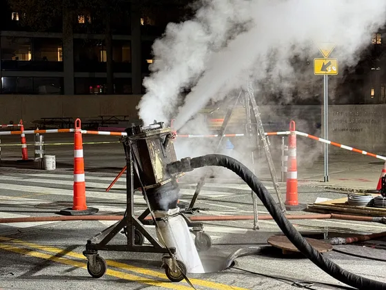 Epoxy liner curing equipment at a night jobsite