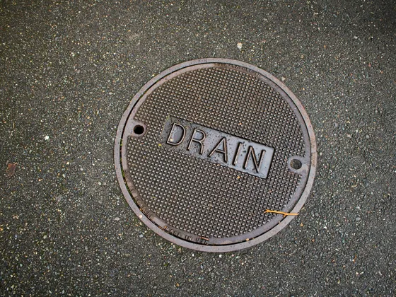Round drain cover at a cleanout access
