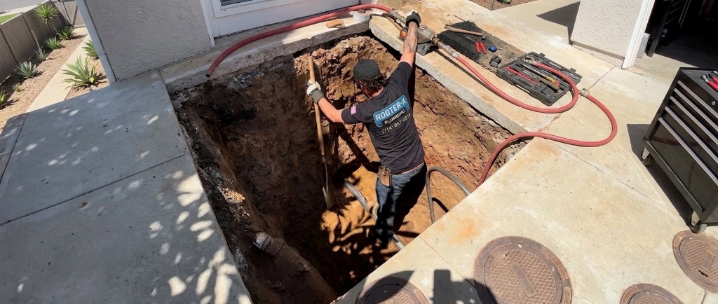 Rooter-X technician on main sewer line excavation job site